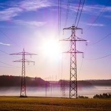 Electrical lines stretch across farmland in the Midwest.